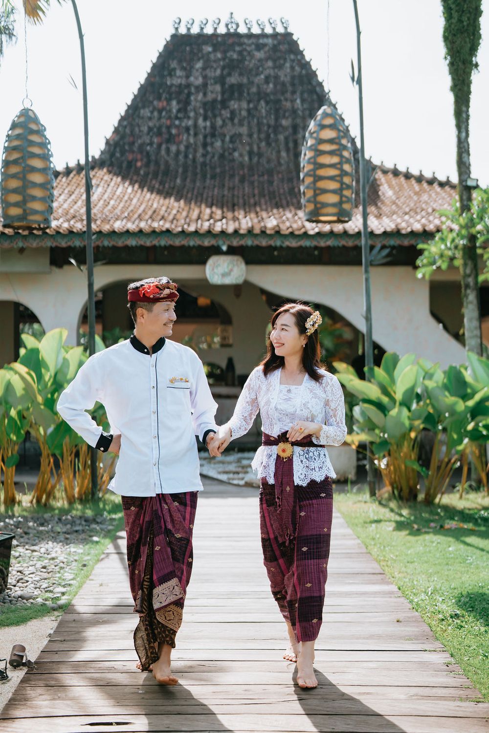 Couple wearing traditional Balinese costumes during a photoshoot at Alaya Ubud.