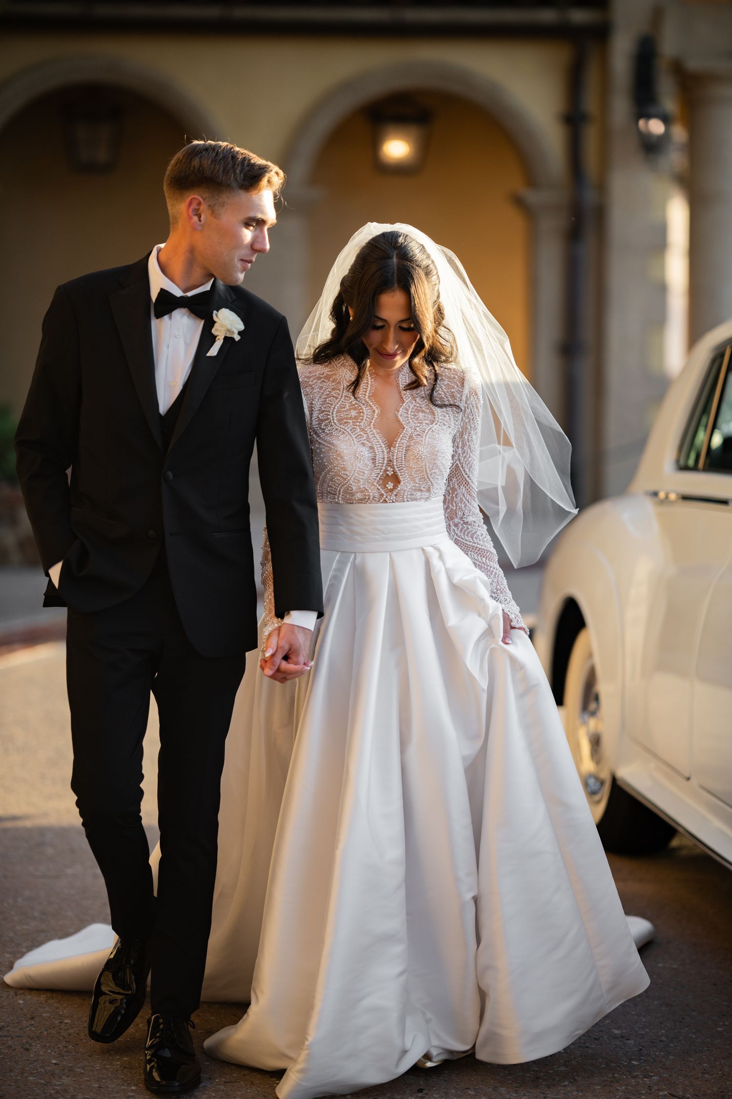 Bride and groom portrait Bella Collina stone archway wedding Montverde Weddings by Ray
