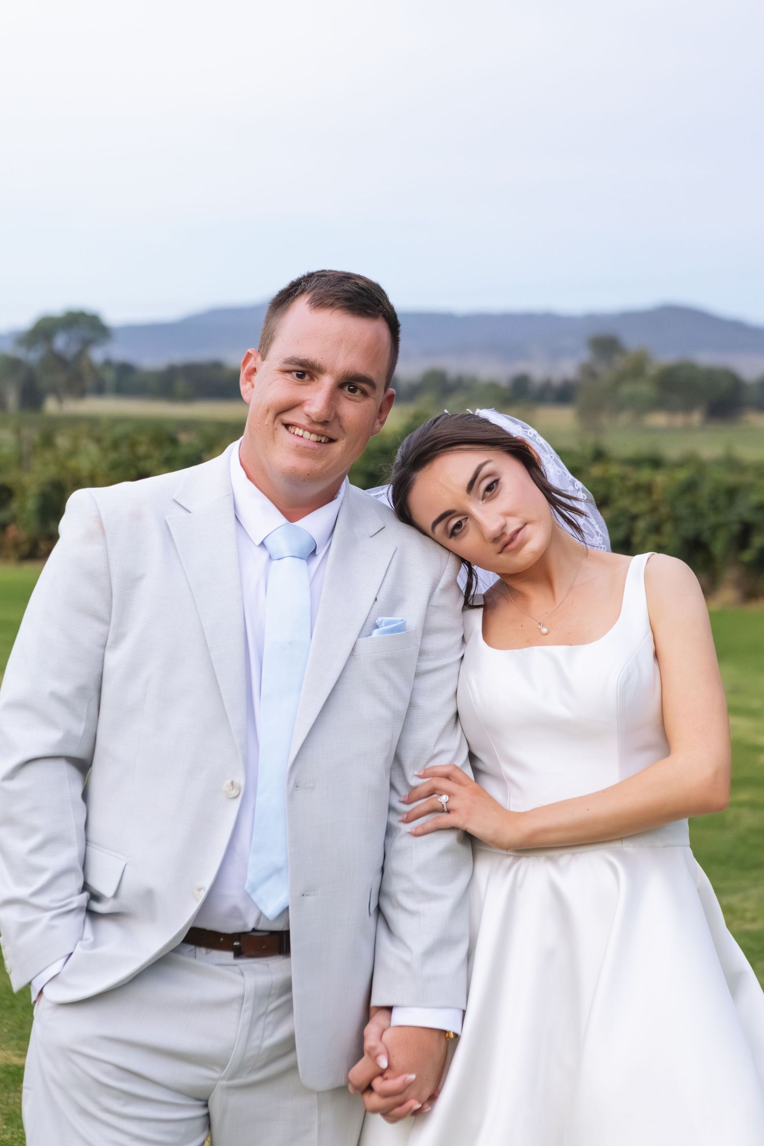 Bride and groom hugging at Two Rivers Winery Wedding in Denman