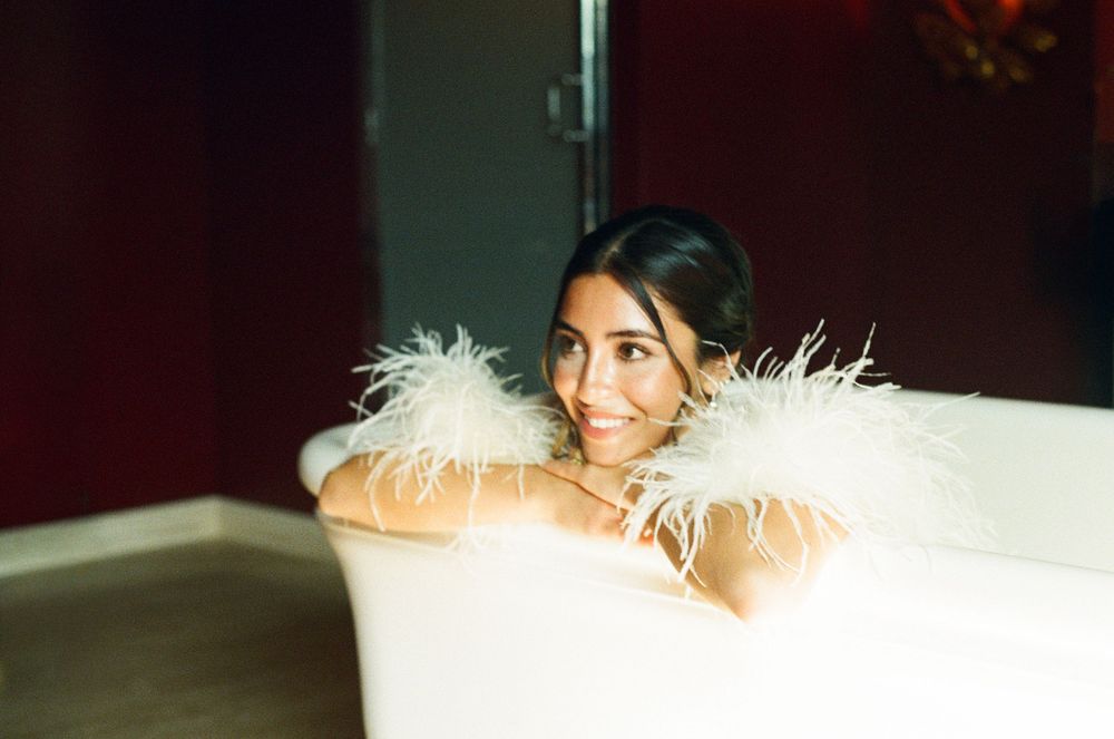 paris bride, paris wedding photographer, paris cinematic photographer, feather dress bride in bathtub, hotel particulier montmartre, film