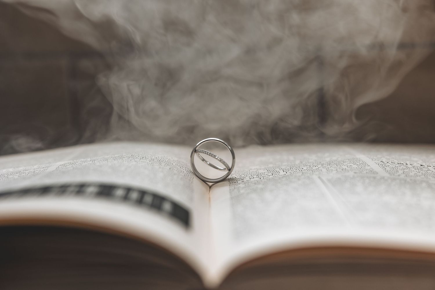 A staged ring shot on a book with fake smoke