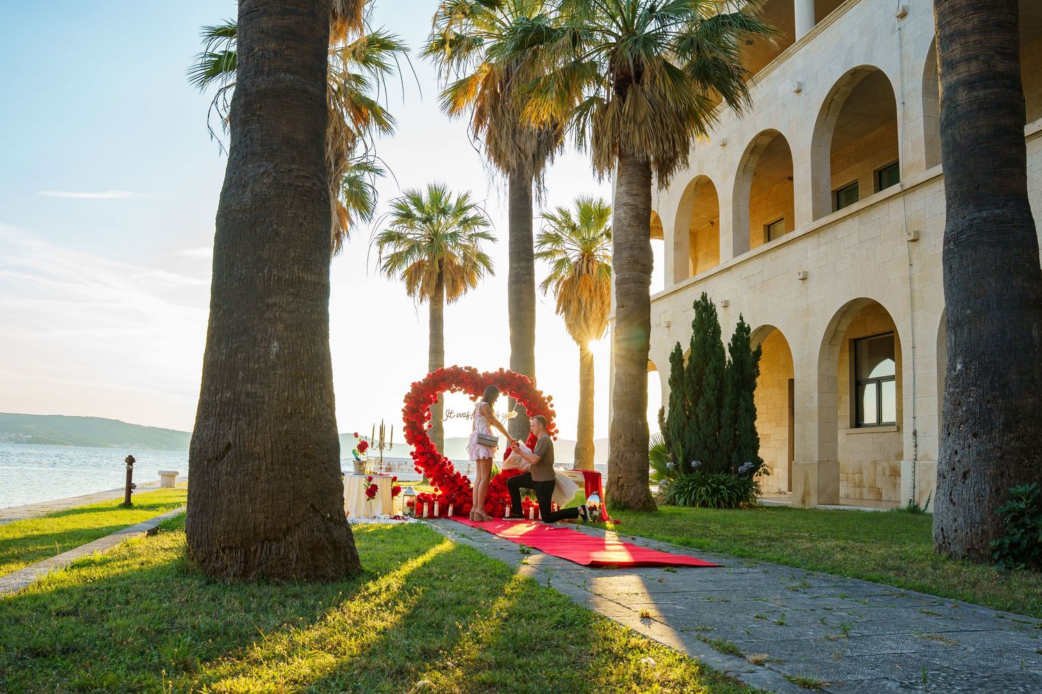 Luxury surprise proposal in Split, Croatia at sunset with romantic decorations and professional engagement photographer.