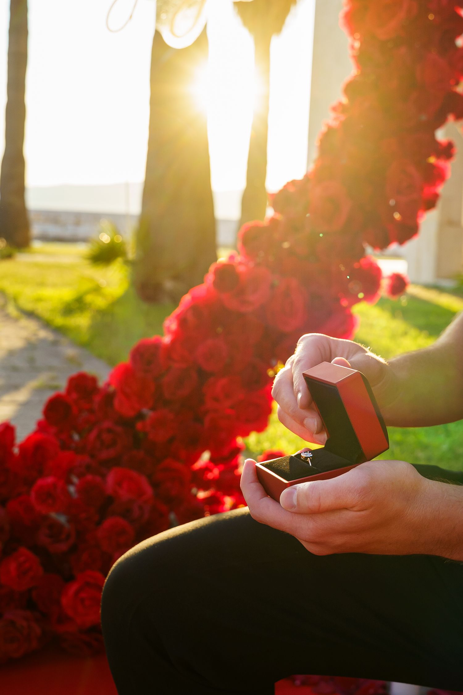 Luxury surprise proposal in Split, Croatia at sunset with romantic decorations and professional engagement photographer.