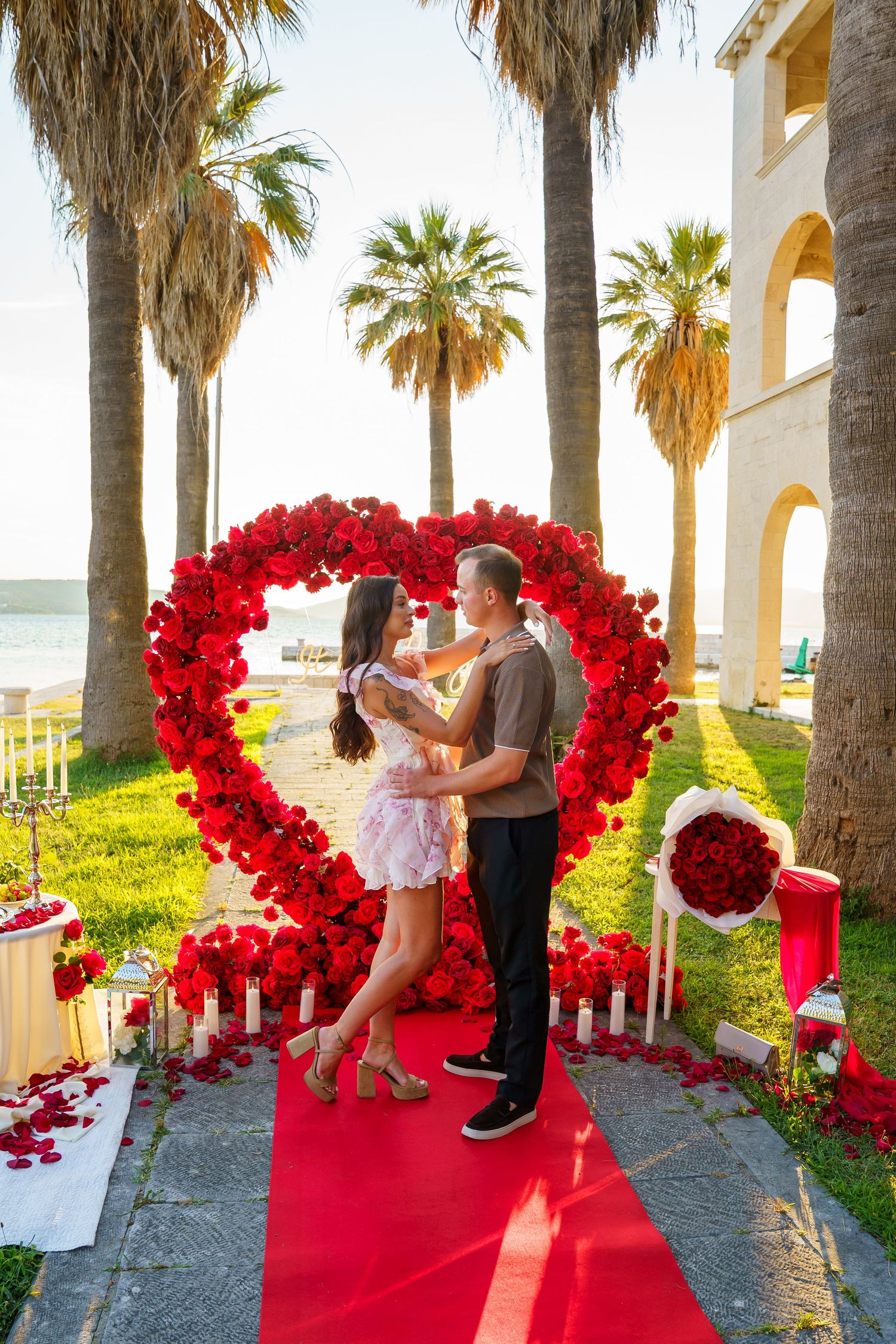 Luxury surprise proposal in Split, Croatia at sunset with romantic decorations and professional engagement photographer.