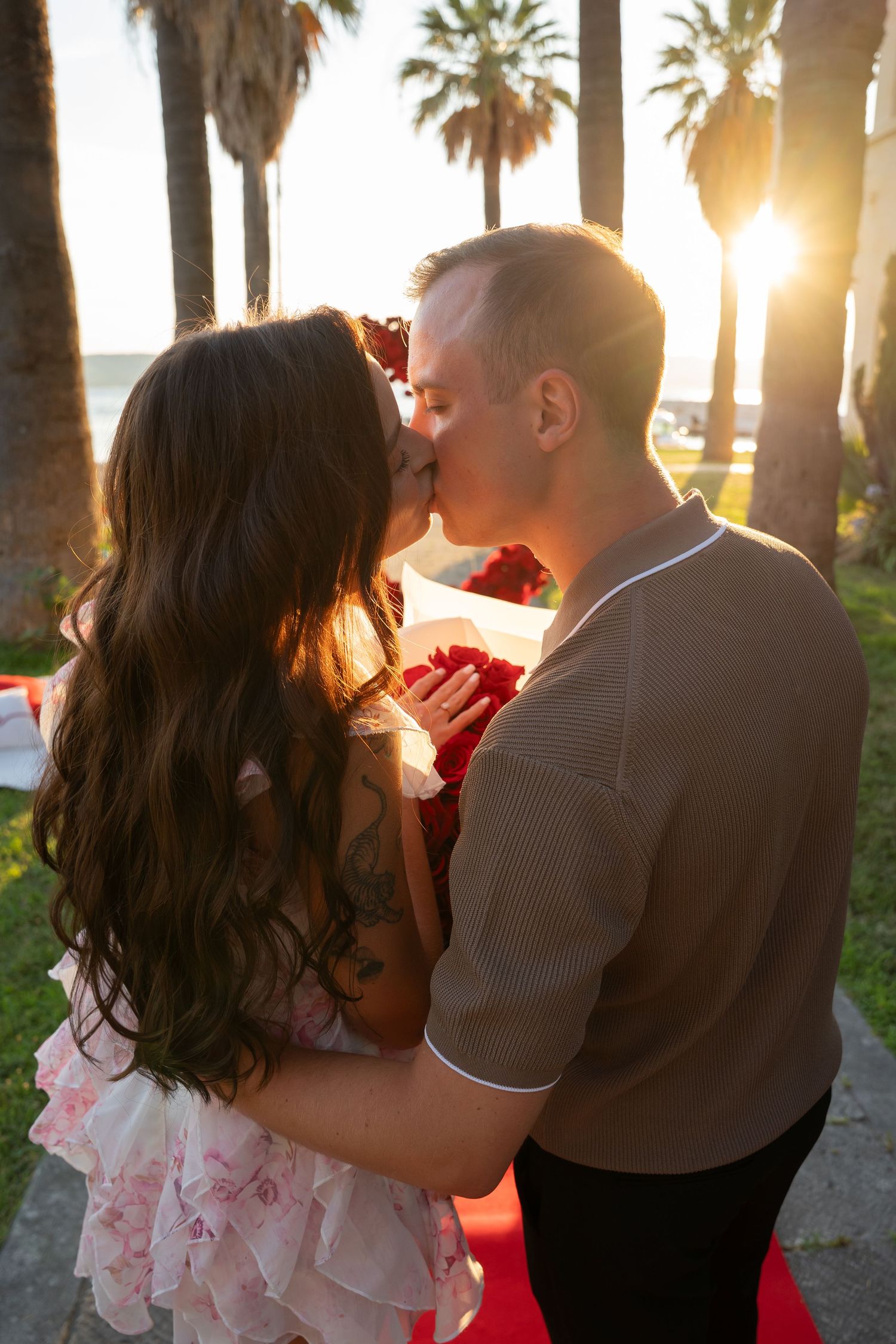Luxury surprise proposal in Split, Croatia at sunset with romantic decorations and professional engagement photographer.