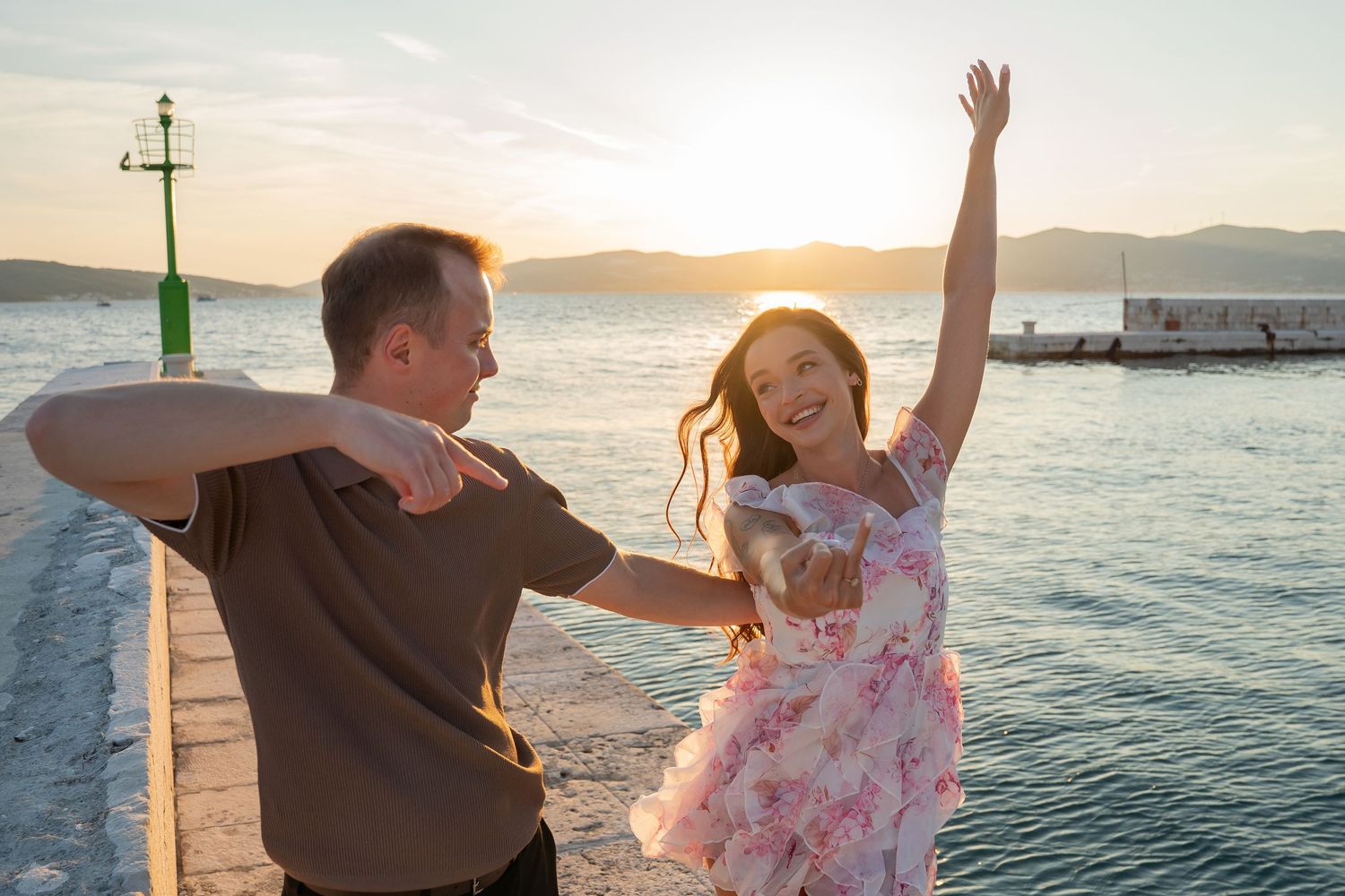 Luxury surprise proposal in Split, Croatia at sunset with romantic decorations and professional engagement photographer.