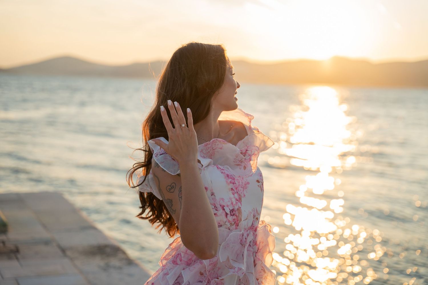 Luxury surprise proposal in Split, Croatia at sunset with romantic decorations and professional engagement photographer.