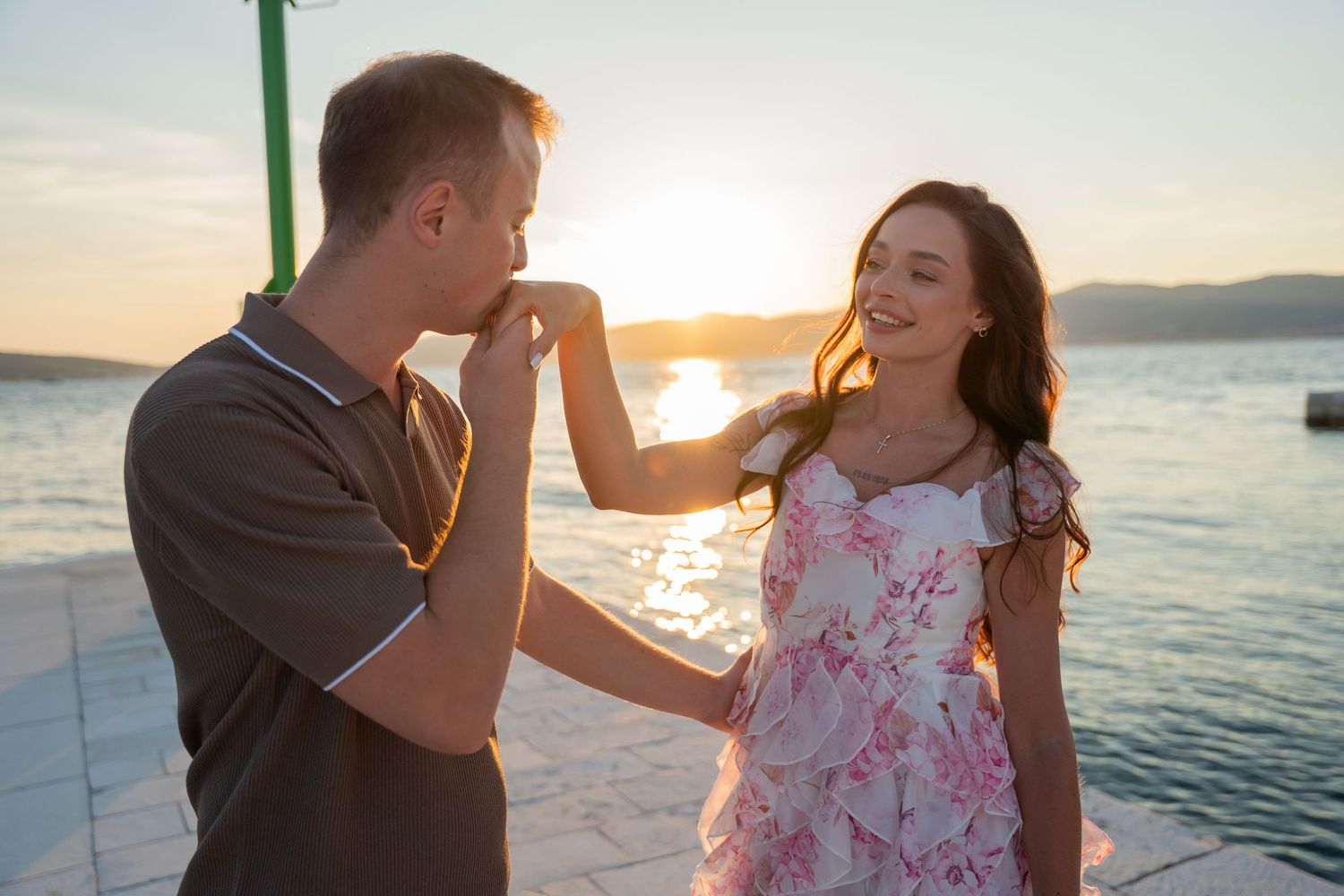 Luxury surprise proposal in Split, Croatia at sunset with romantic decorations and professional engagement photographer.