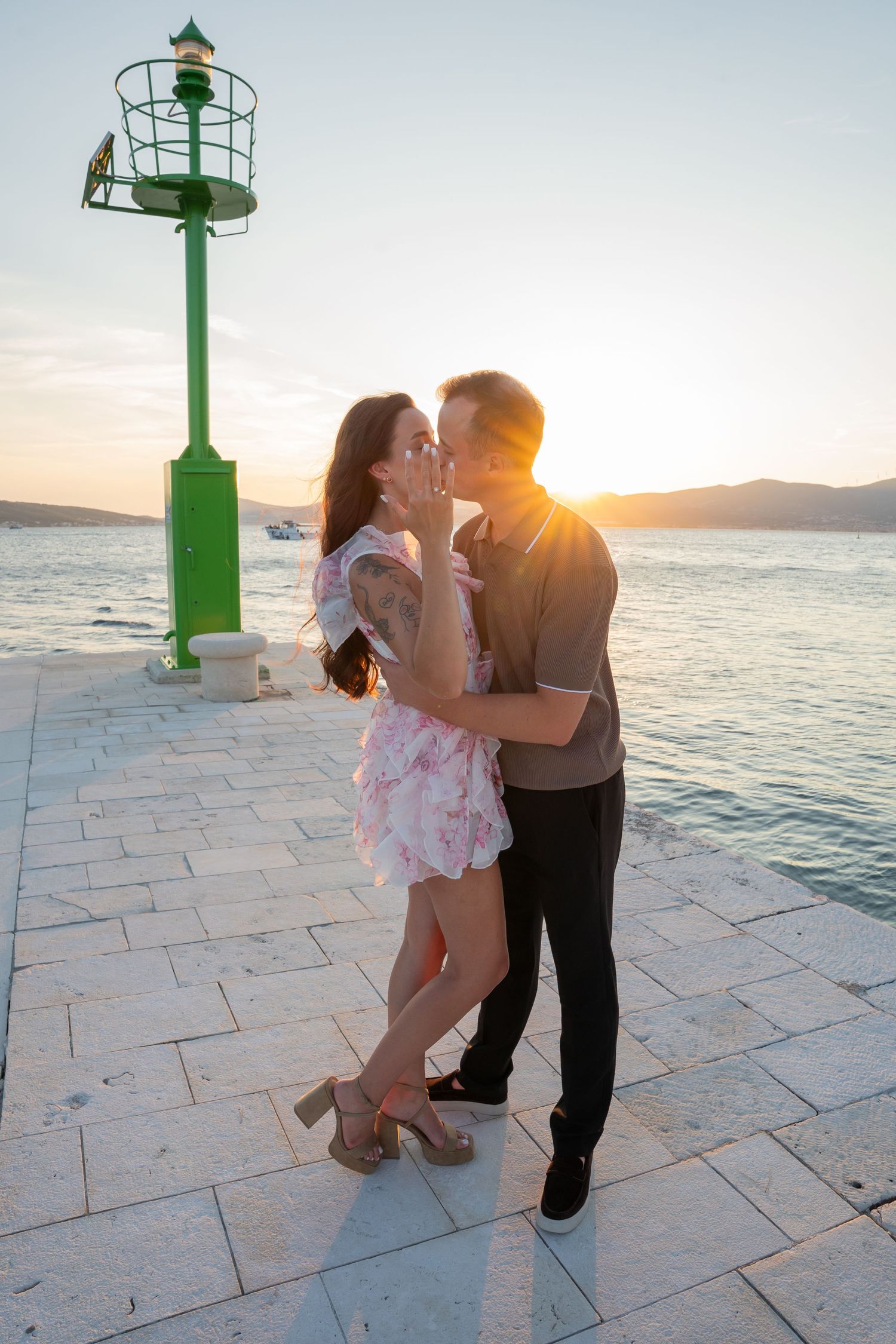 Luxury surprise proposal in Split, Croatia at sunset with romantic decorations and professional engagement photographer.
