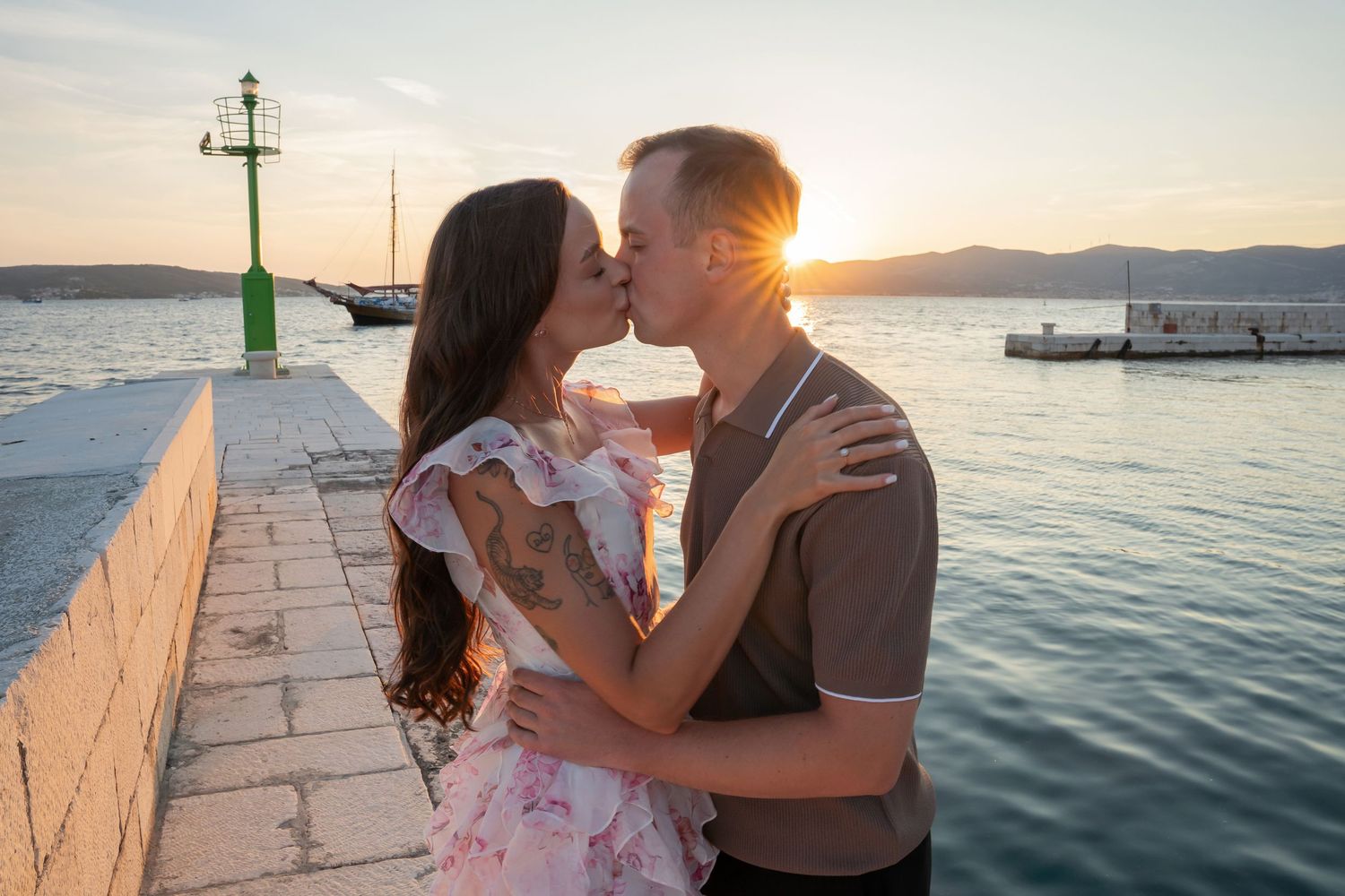 Luxury surprise proposal in Split, Croatia at sunset with romantic decorations and professional engagement photographer.