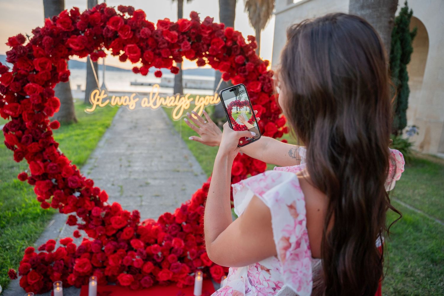 Luxury surprise proposal in Split, Croatia at sunset with romantic decorations and professional engagement photographer.