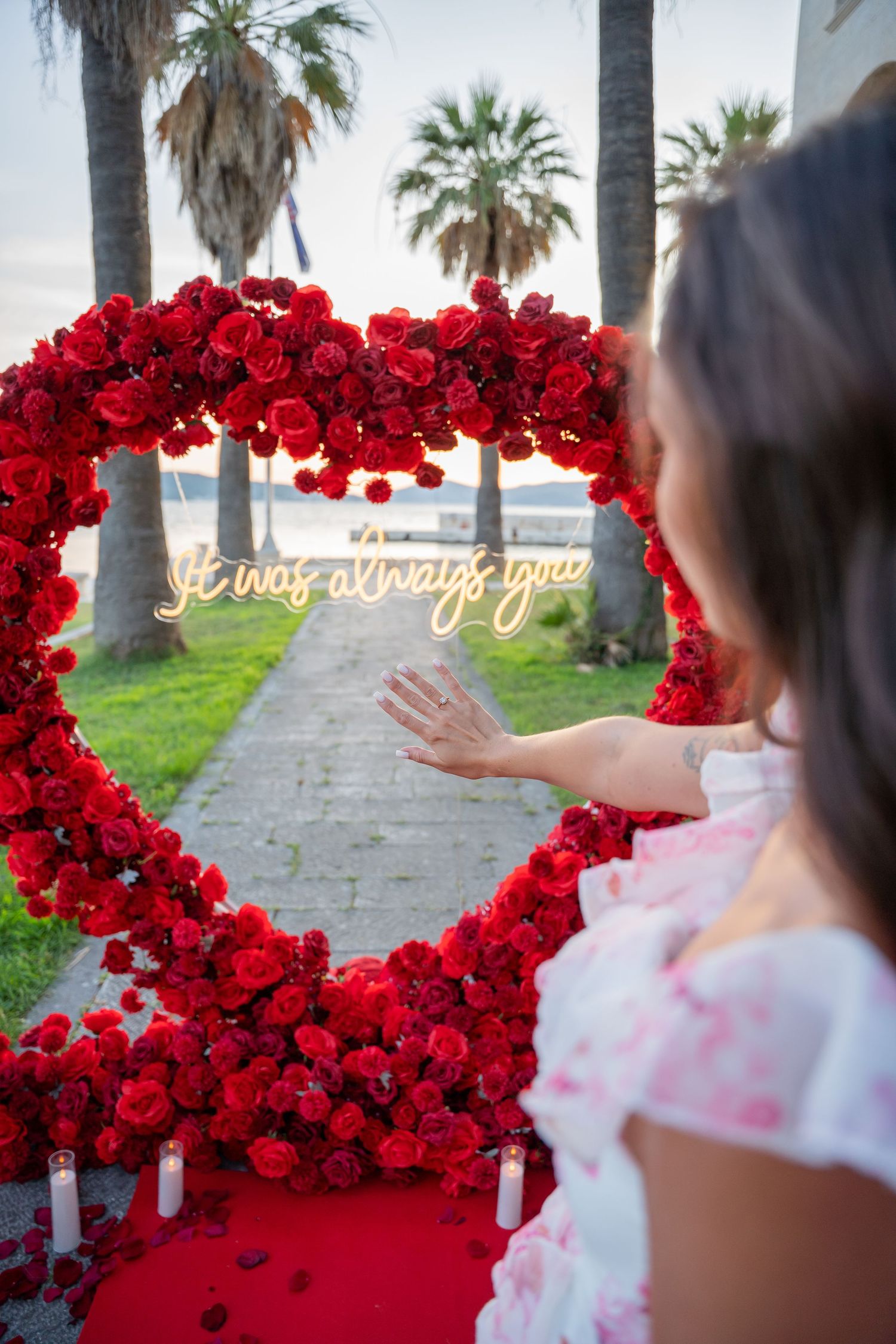Luxury surprise proposal in Split, Croatia at sunset with romantic decorations and professional engagement photographer.