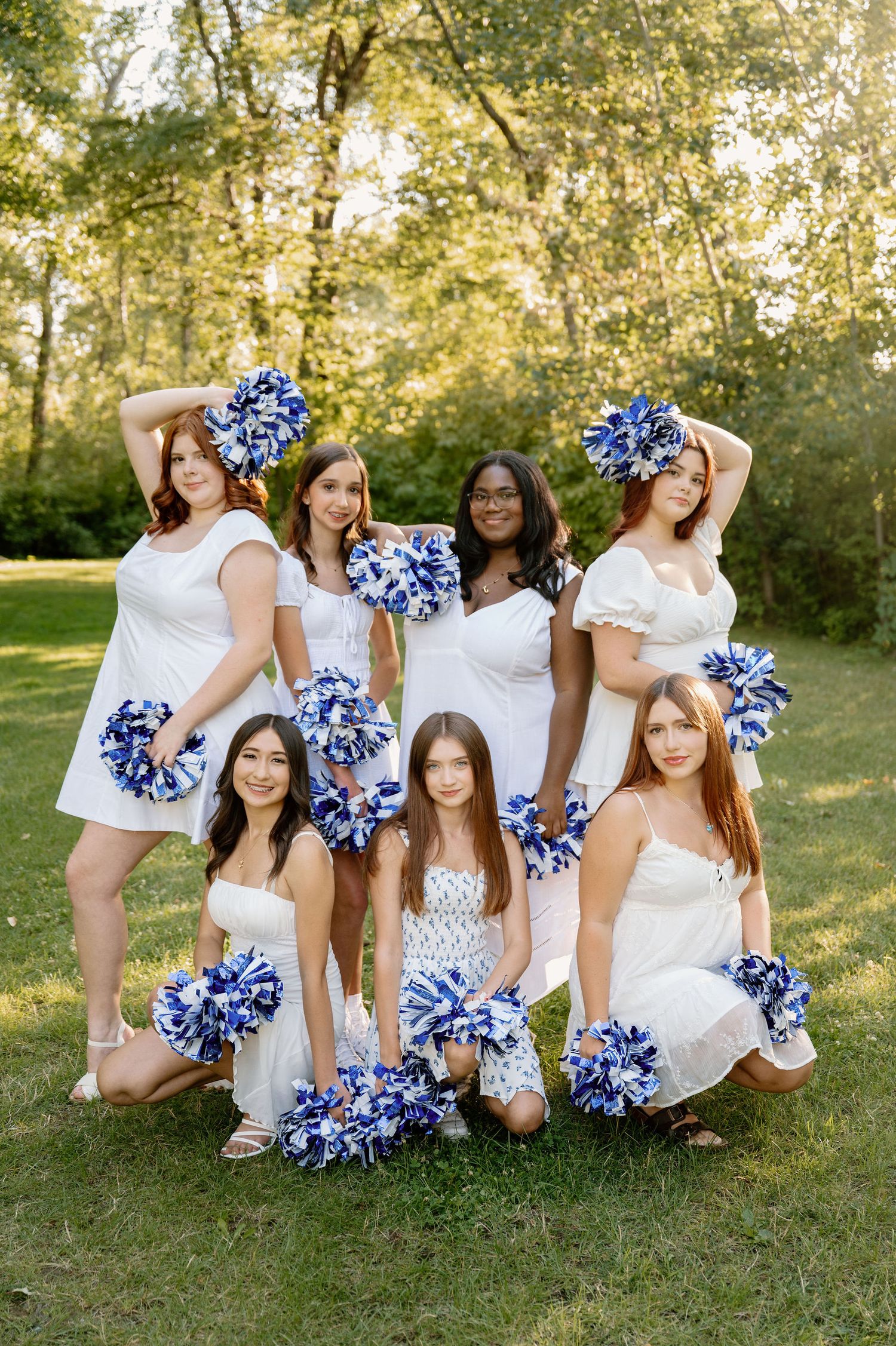 Walla Walla High School dance team photoshoot with blue and white pom poms and white dresses