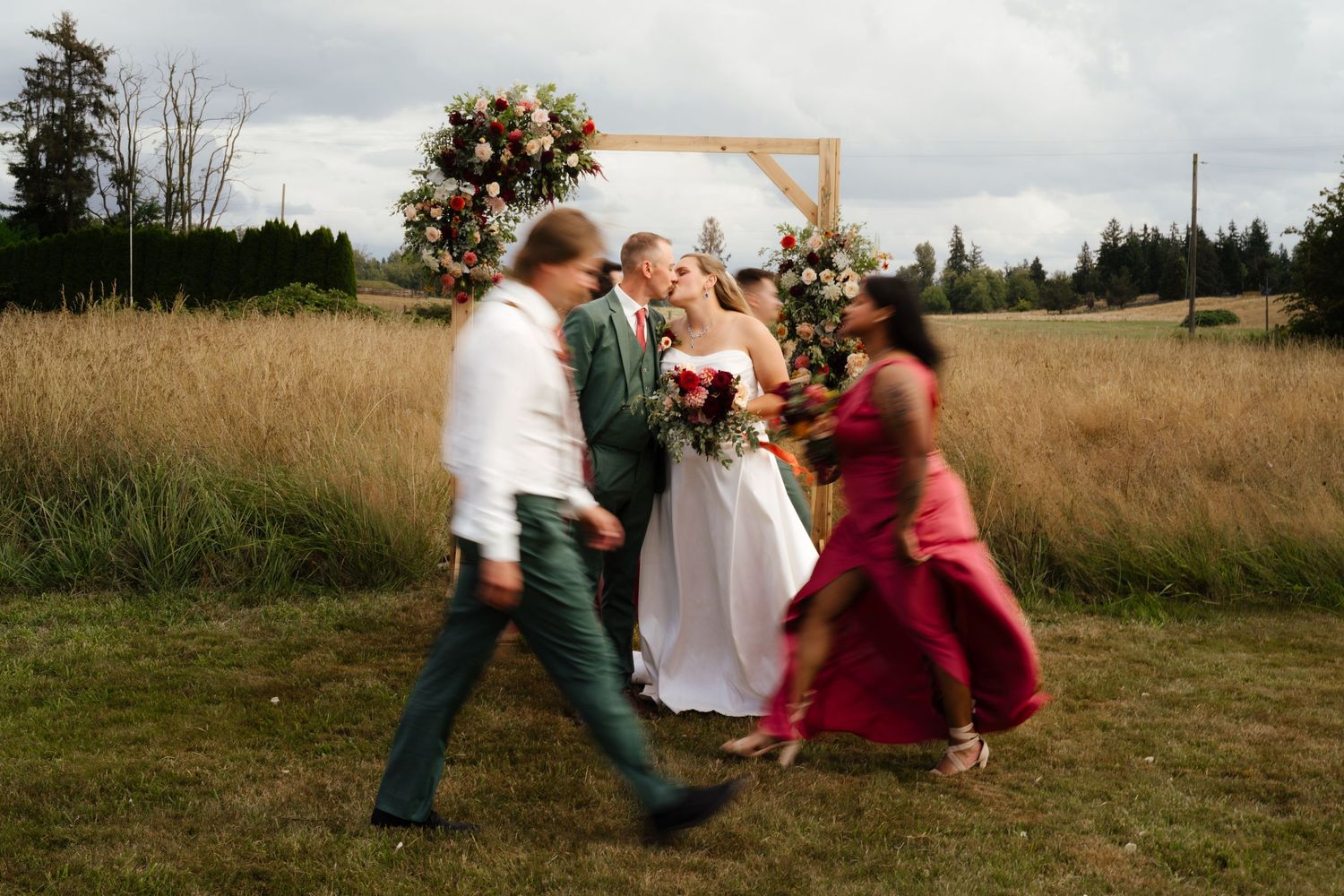 Asian Bride and groom look at each other and smile during their ceremony at The Cedars in Snohomish WA.