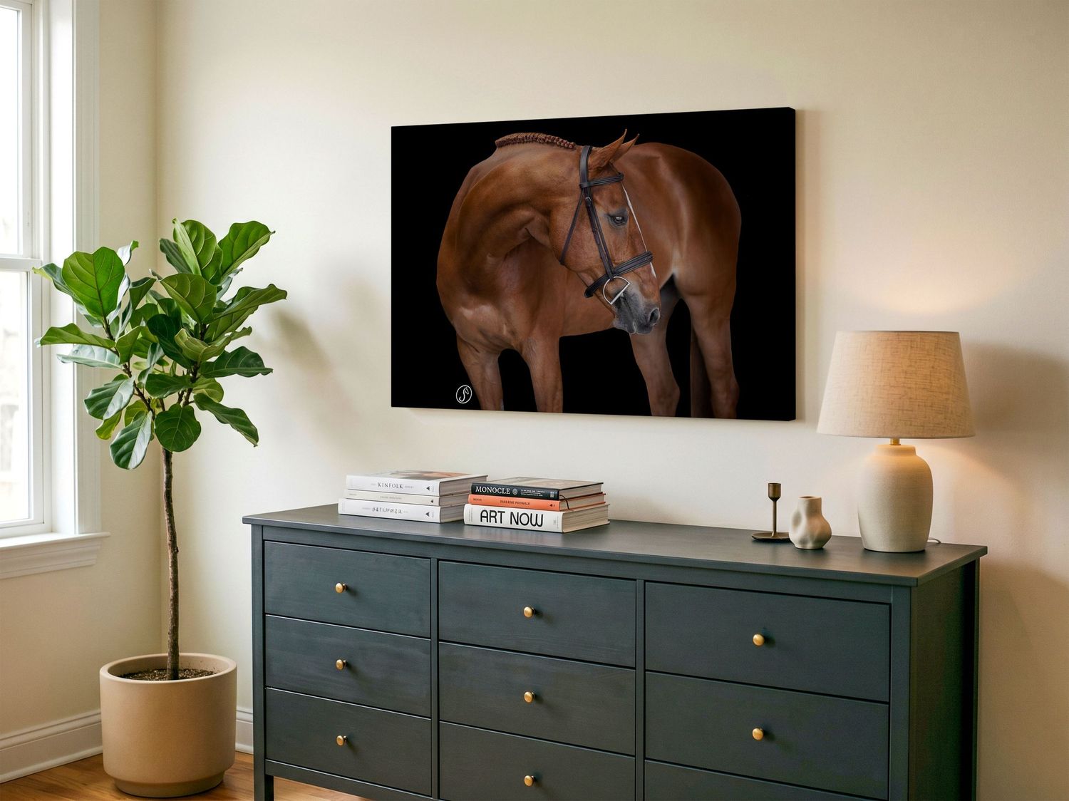 Two framed horse photography prints displayed above a sofa, showing close-up views of horse hindquarters and hooves.