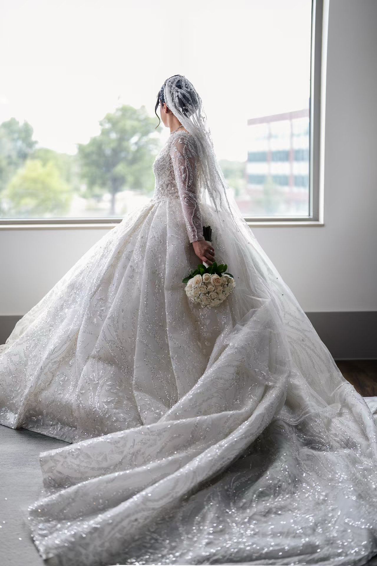 Bride getting ready in renaissance wedding venue.