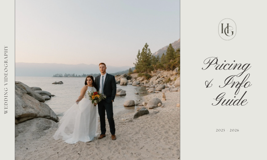 A wedding couple stands on a rocky beach at sunset with boats in the water behind them.