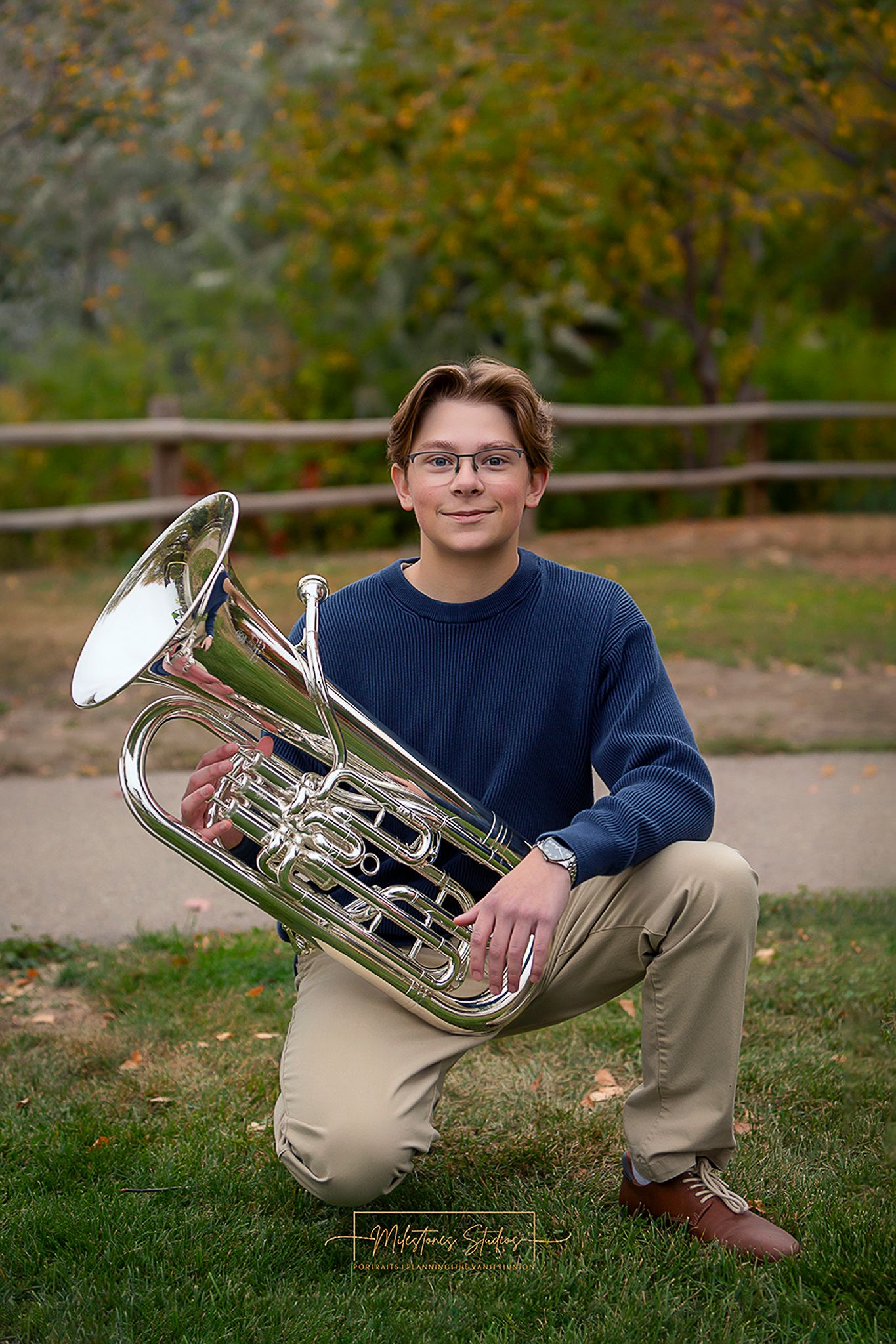Senior portraits on the Boise River Greenbelt in Meridian, Idaho. Class of 2027 session with euphonium
