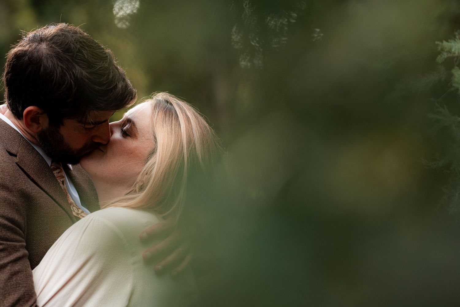 Elopement couple walk together along a peaceful Mount Wellington forest trail in Tasmania. Elopement photographer.