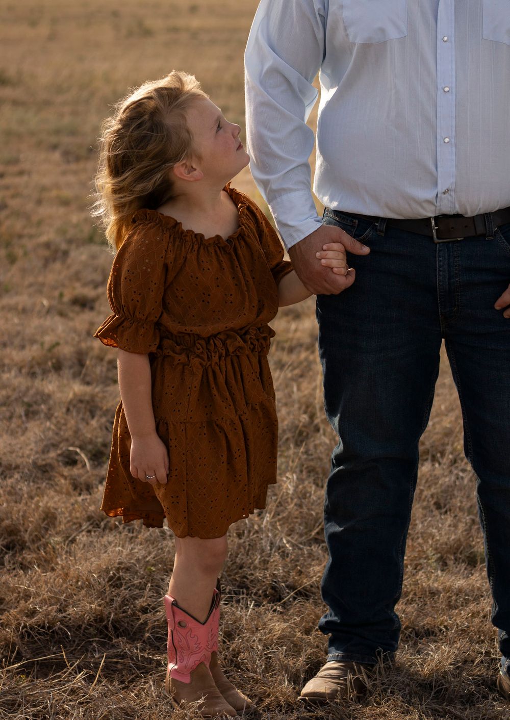 A young girl during a family photo session at an open field in Amarillo, Texas