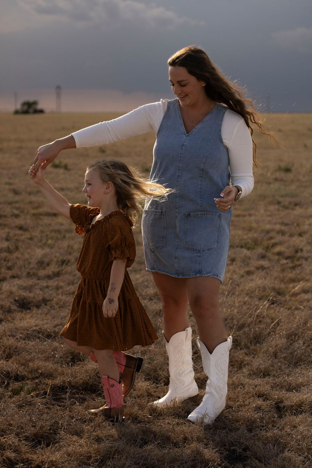 A mother and daughter during a family photo session at an open field in Amarillo, Texas