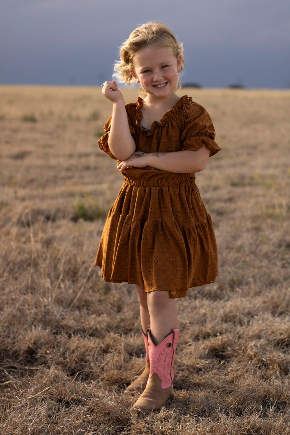 A young girl during a family photo session at an open field in Amarillo, Texas