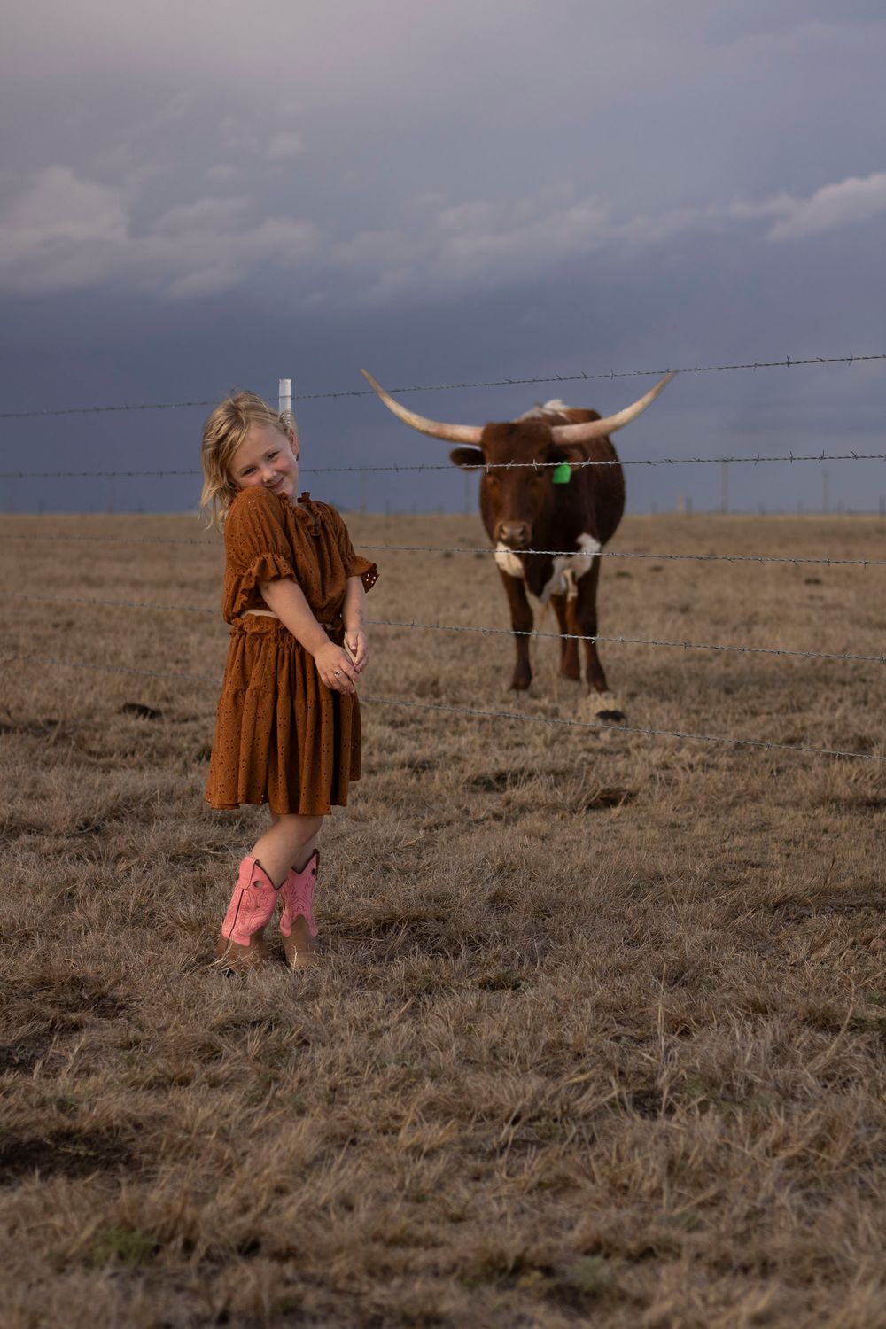 A young girl during a family photo session at an open field in Amarillo, Texas