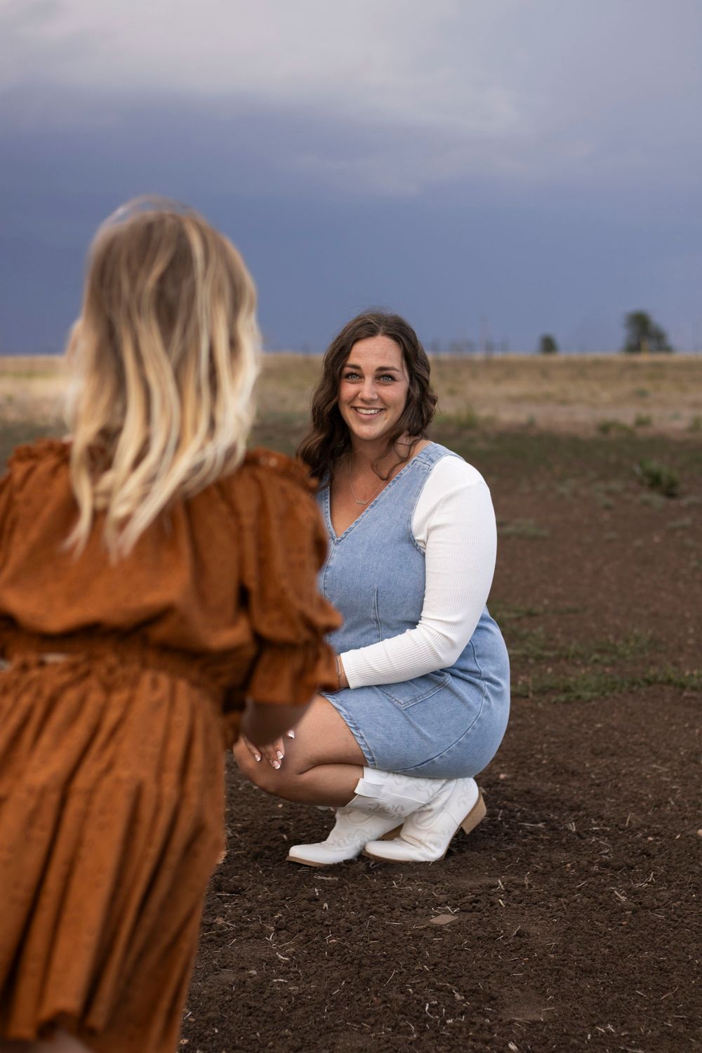 A mother and daughter during a family photo session at an open field in Amarillo, Texas