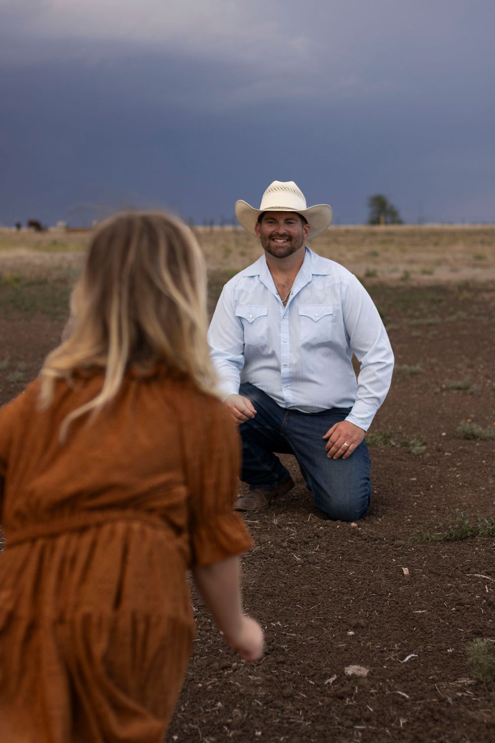 A father and daughter during a family photo session at an open field in Amarillo, Texas