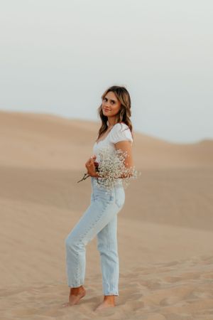 Girl Happy to Graduate in California/Arizona and is a graduate. In the sand dunes