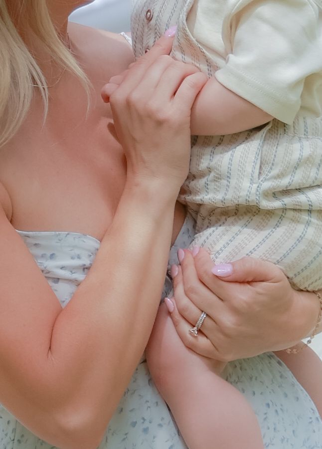 Intimate moments captured on a textured cream blanket during a lifestyle session.