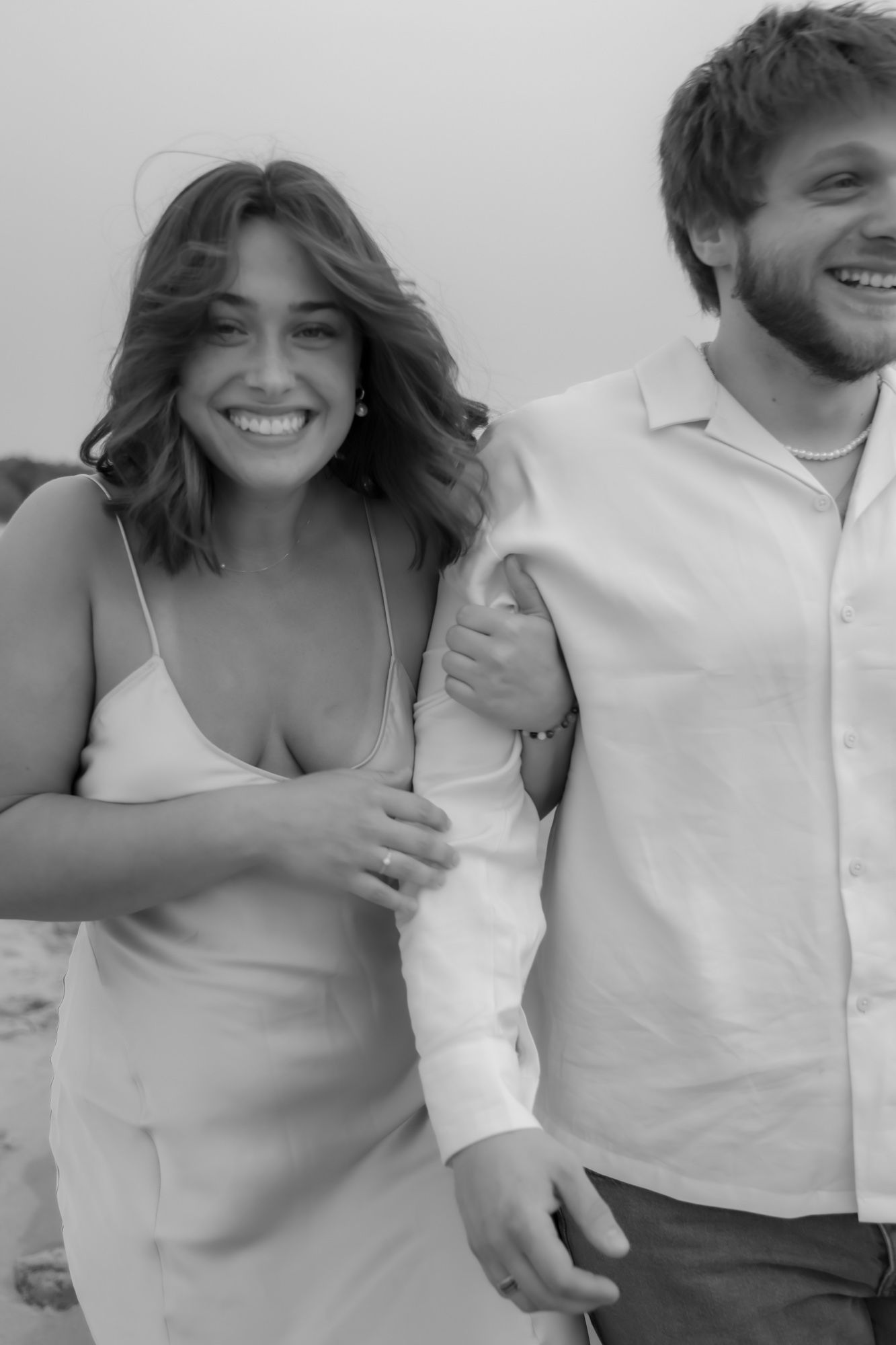 Black and white series of candid moments showing couple laughing together.