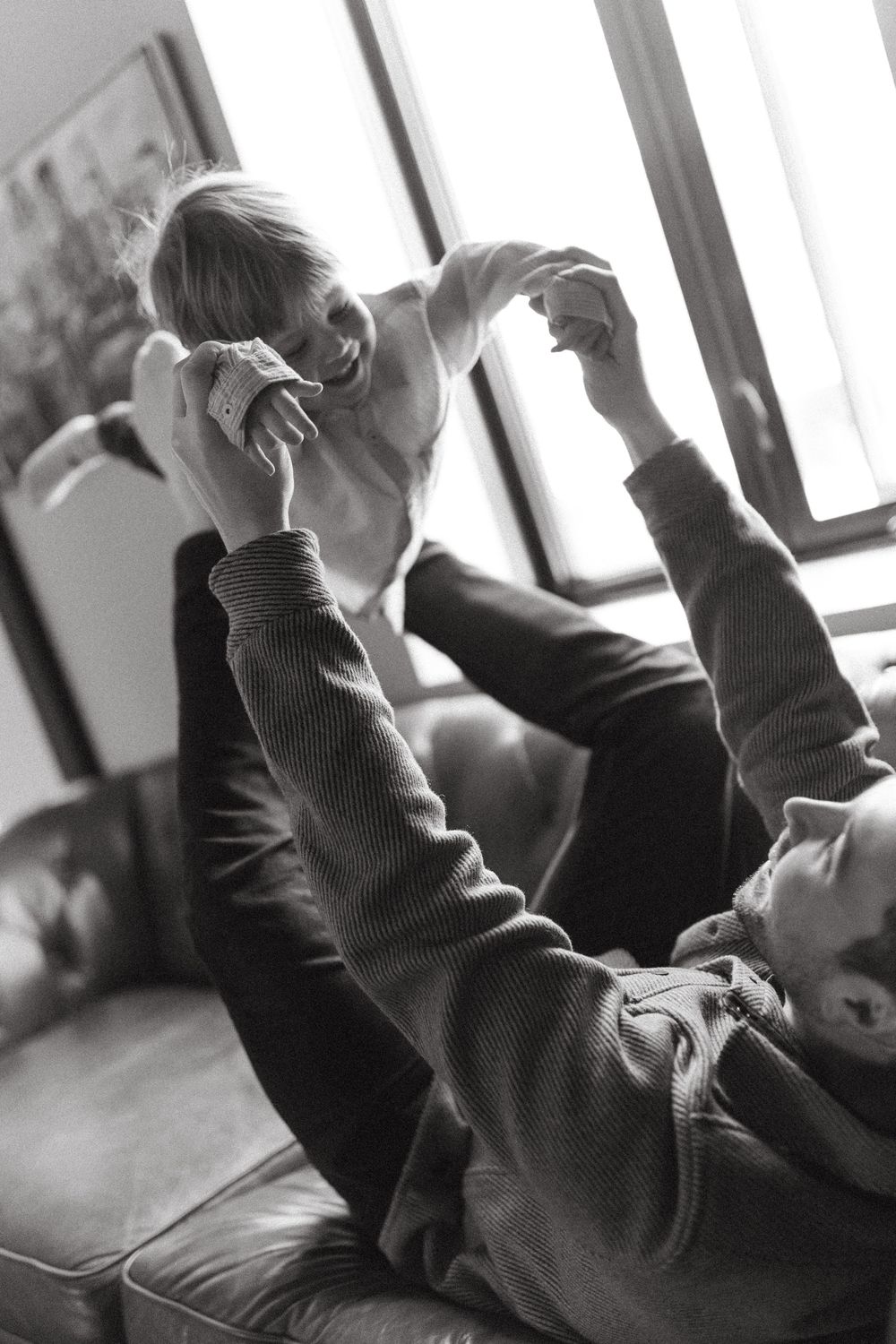 A person reaches up with their hand during what appears to be a classroom or educational setting.
