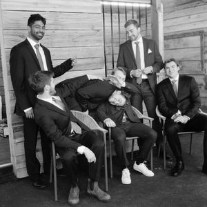 A series of vintage black and white photographs showing people sitting in chairs against a wooden wall.
