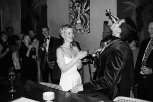 A black and white photo strip showing casual party scenes with people dancing and socializing at what appears to be a celebration.
