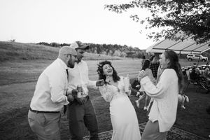Romantic black and white photos showing intimate moments between wedding couple in outdoor rustic setting.