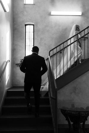 A silhouetted figure ascends a staircase in a noir-style black and white photo sequence showing progressive movement.