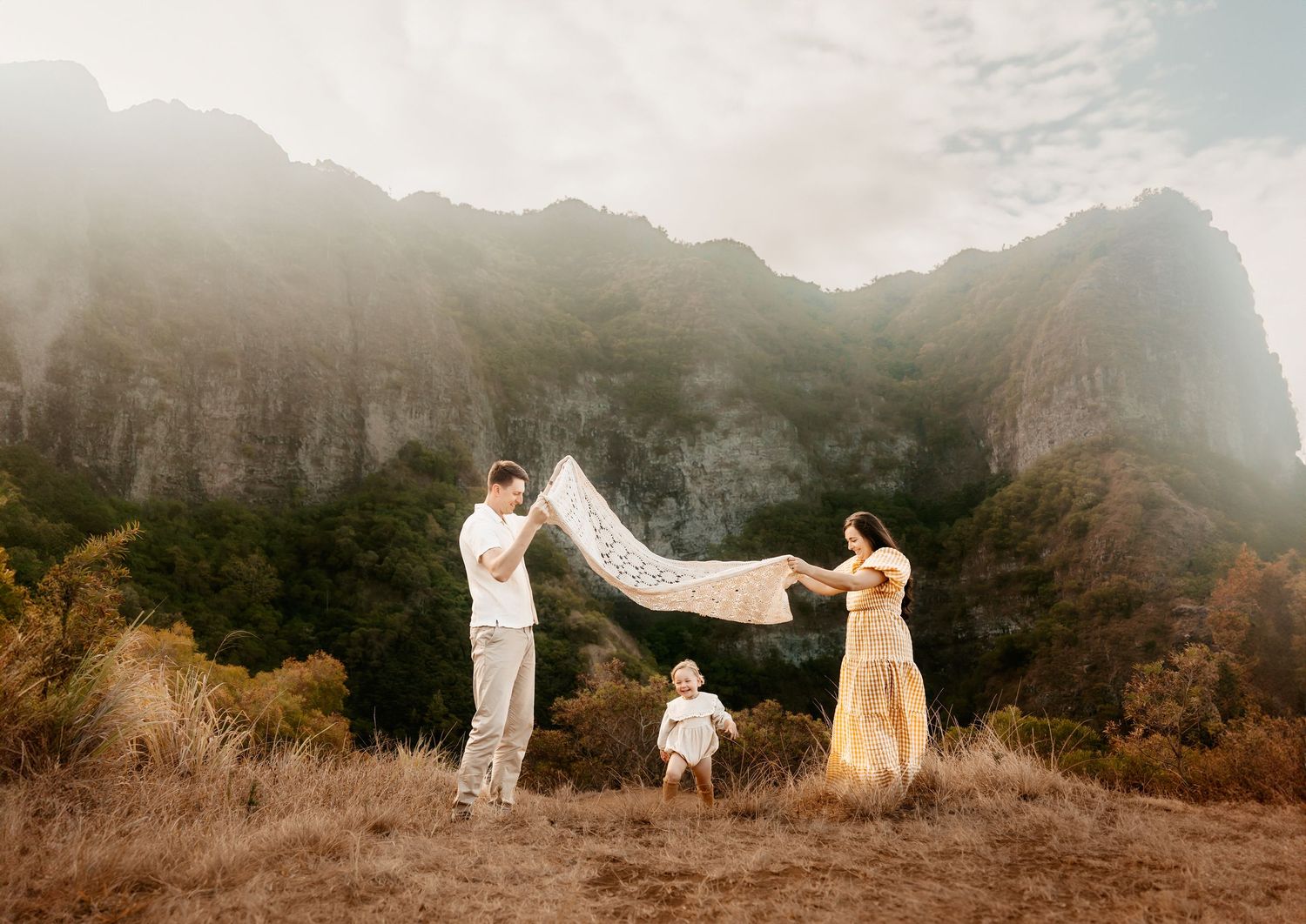 A family hugging each other during golden hour.