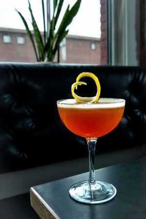 Tater Tots and Penny Slots whiskey cocktail at Hogwash Spokane, photographed for Spokane Cocktail Week 2026 by Kin Creative Studios