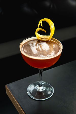 Tater Tots and Penny Slots cocktail at Hogwash Whiskey Den Spokane, captured for Spokane Cocktail Week 2026