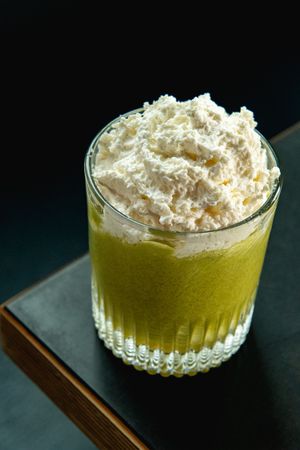 Spokane cocktail photography featuring a green Chakra Colada with coconut cream for Radio Bar