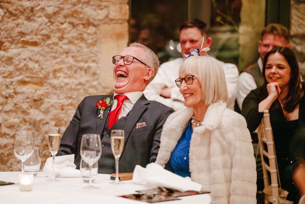 Priston Mill wedding photography Bath Somerset guests laughing during speeches