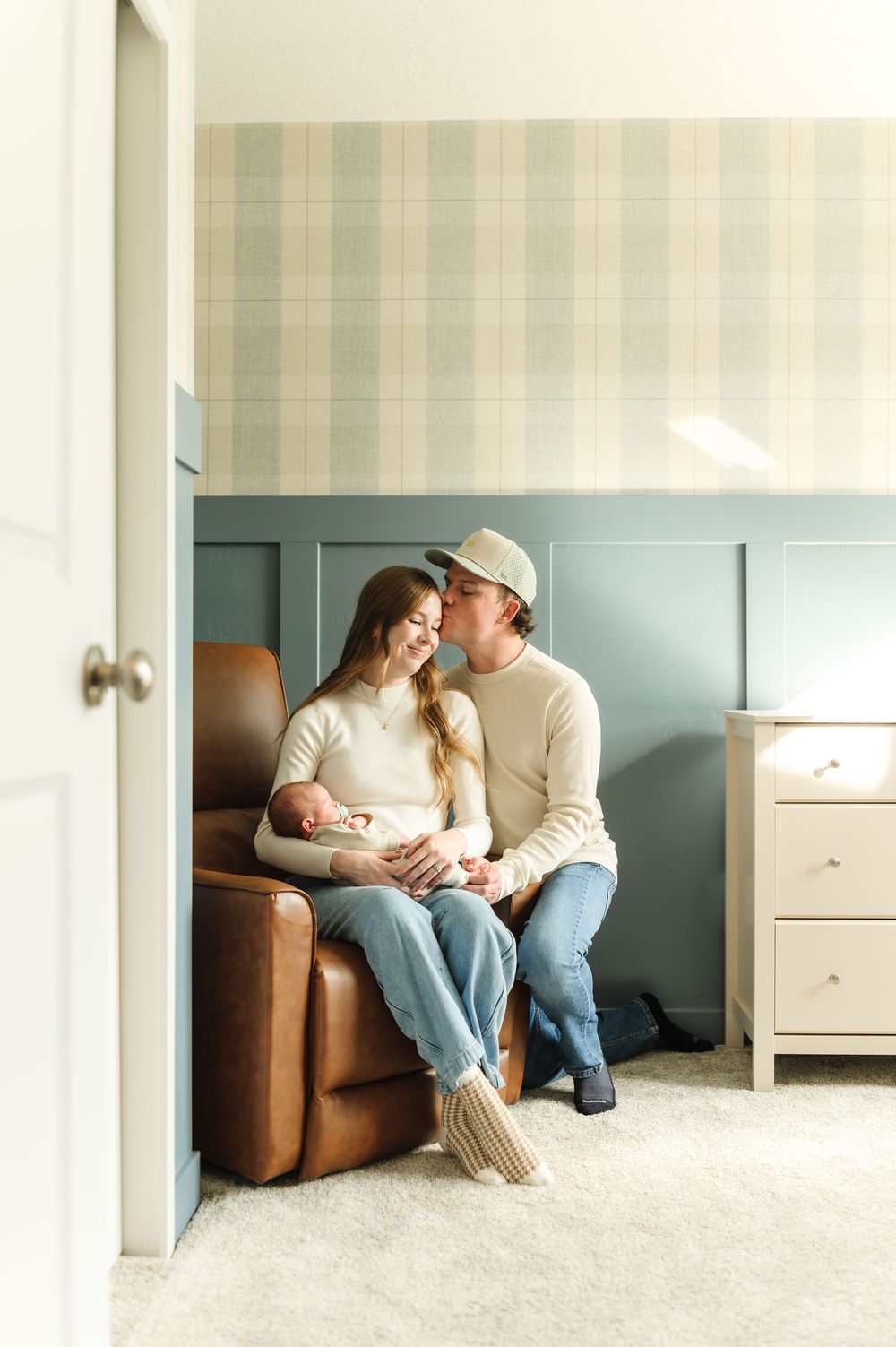 A series of intimate family moments captured in a living room with soft lighting and neutral decor.
