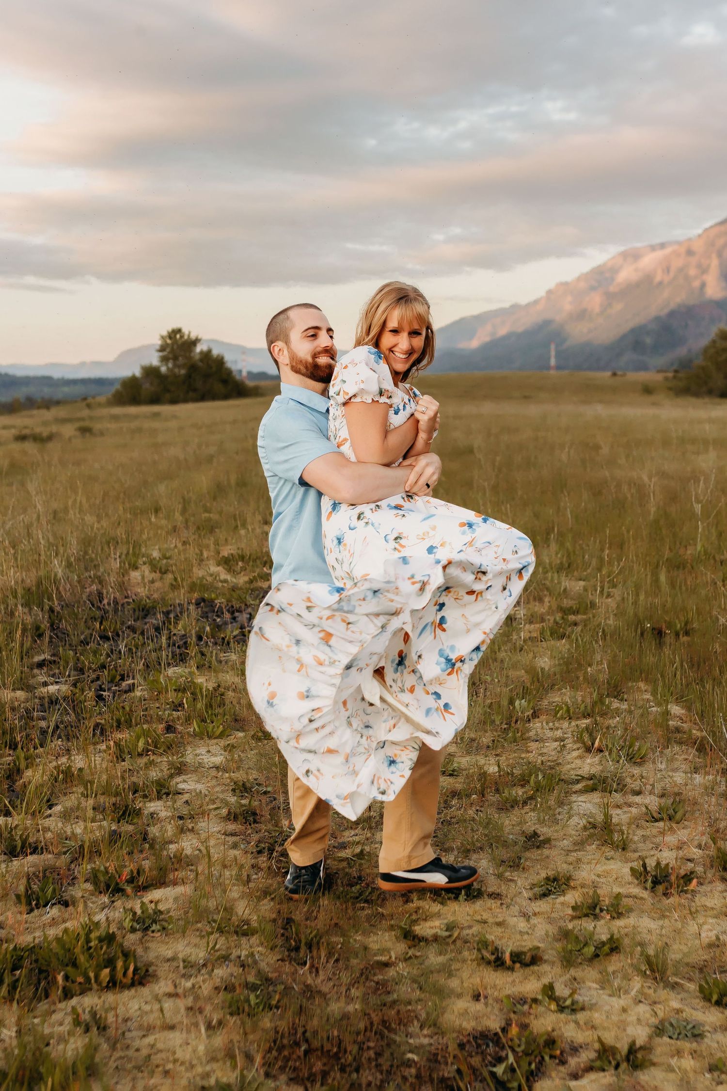 Husband lifts wife in embrace