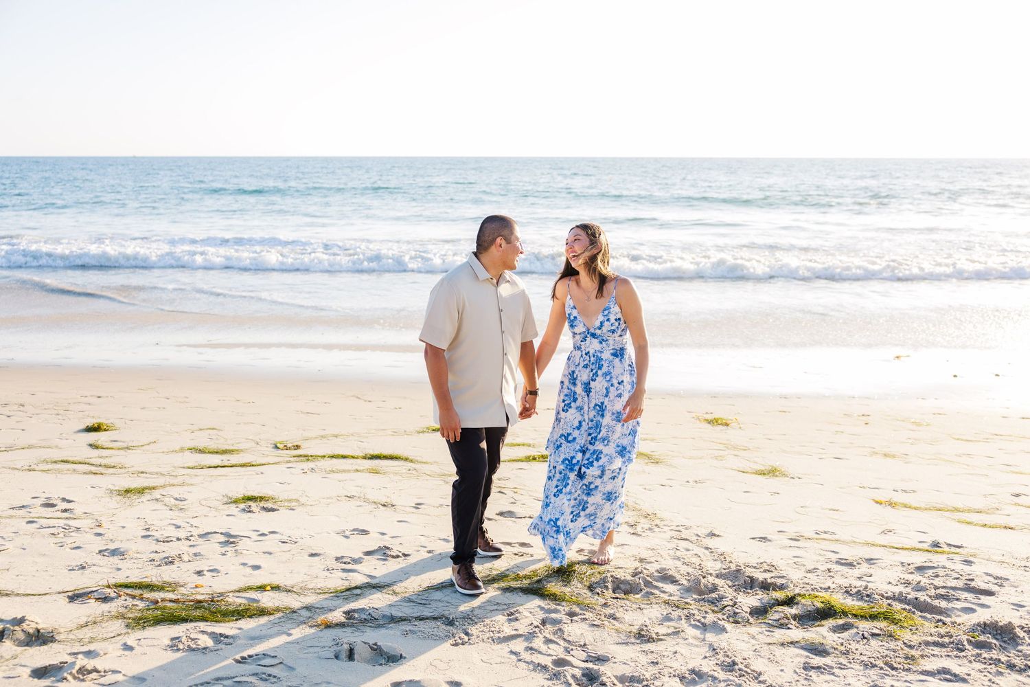 Engagement session walking on the beach in San Clemente