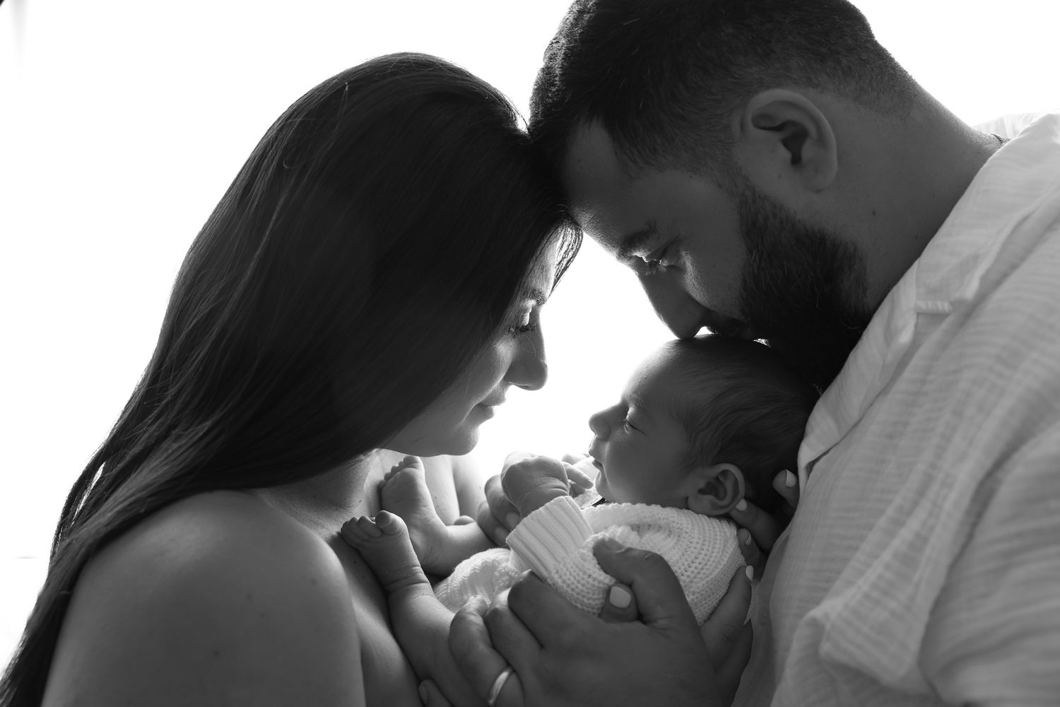 back lit black and white classic image for new parents baby girl