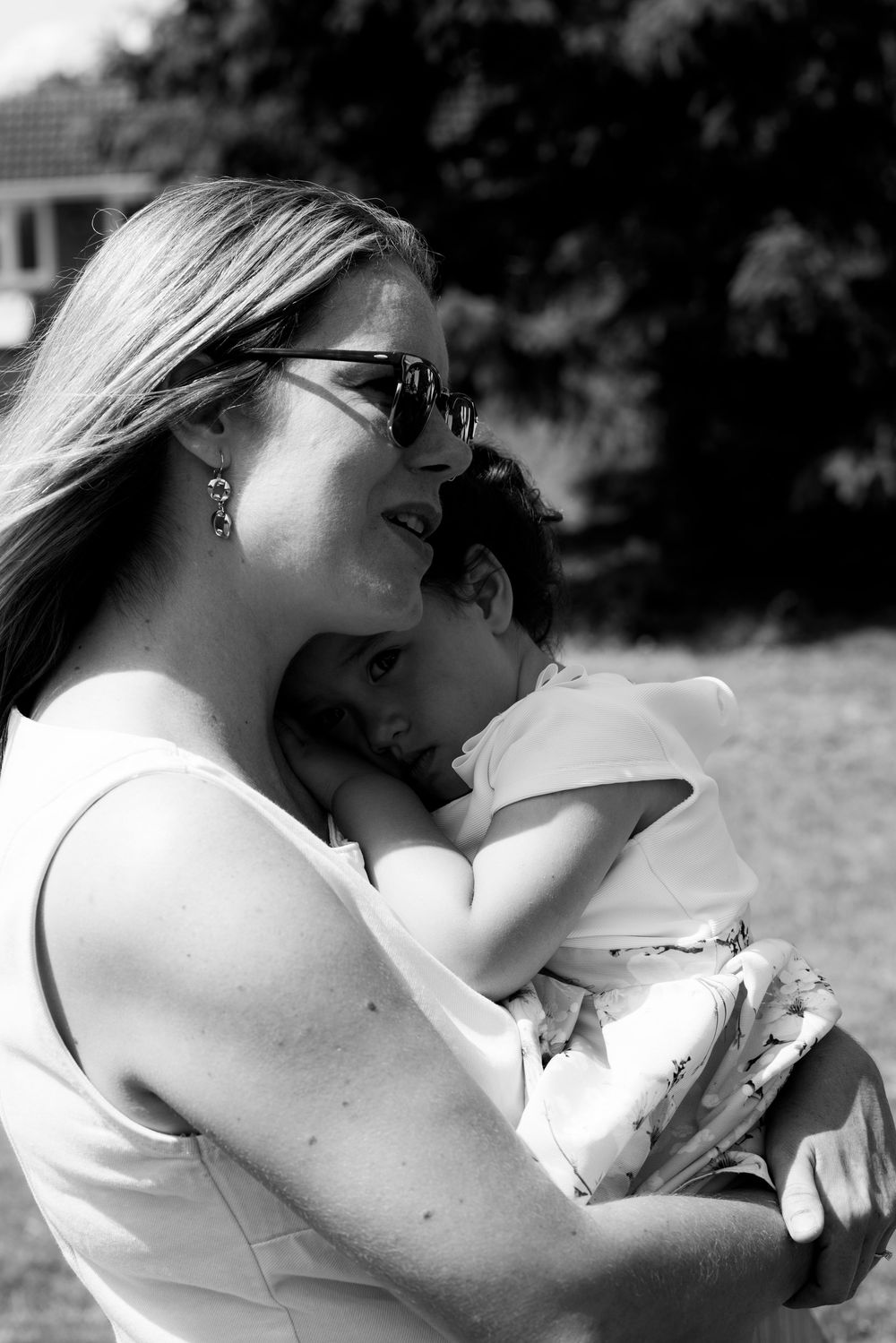 A couple sharing a romantic moment in a black and white outdoor photoshoot.