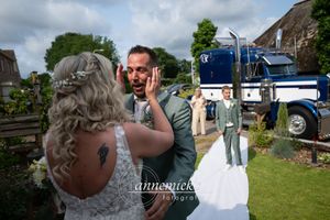 Wedding celebration outdoors on a cloudy day with decorative elements and guests.