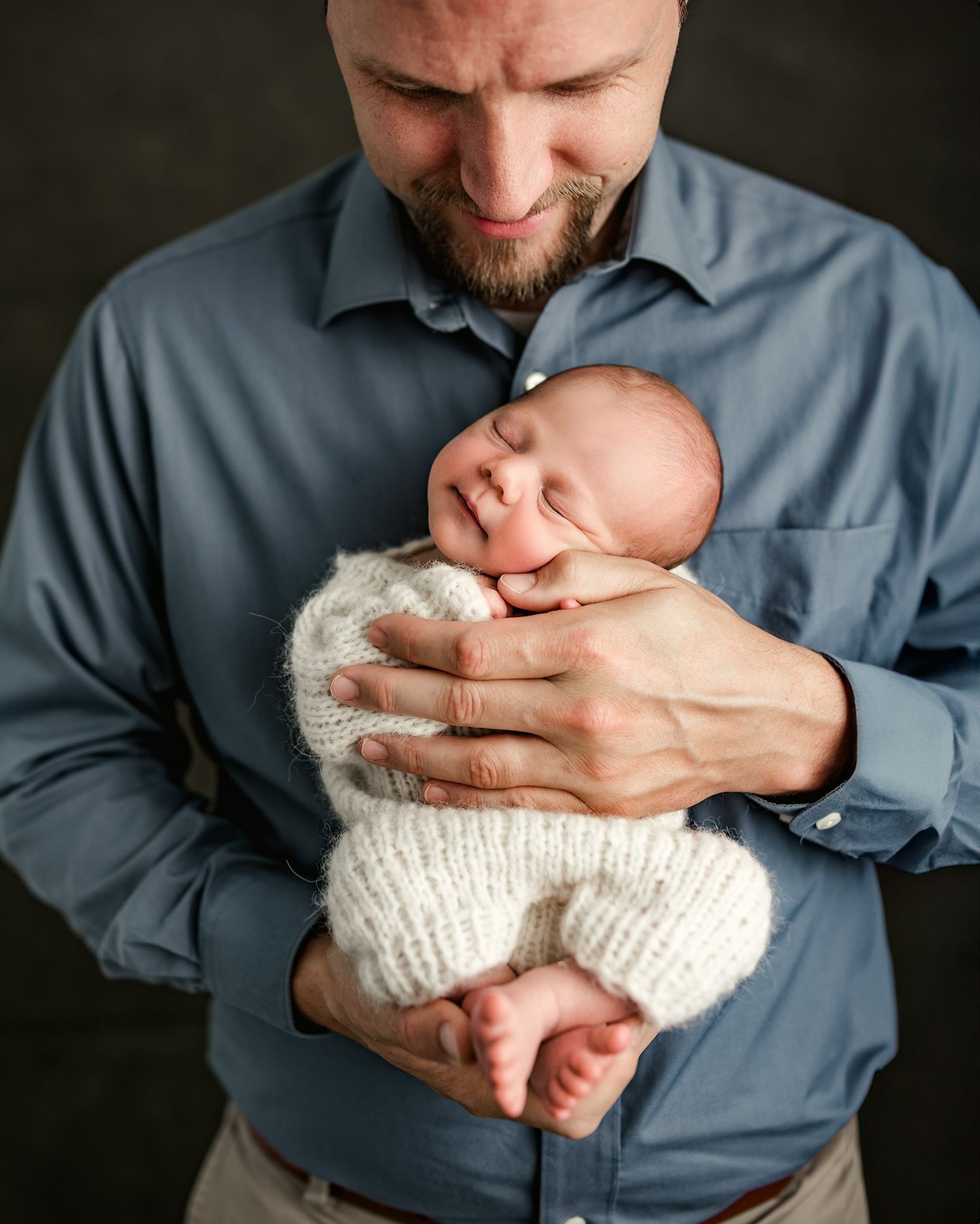 Dad holding newborn baby boy portrait baby smiling | Three Little Bees Photographer
