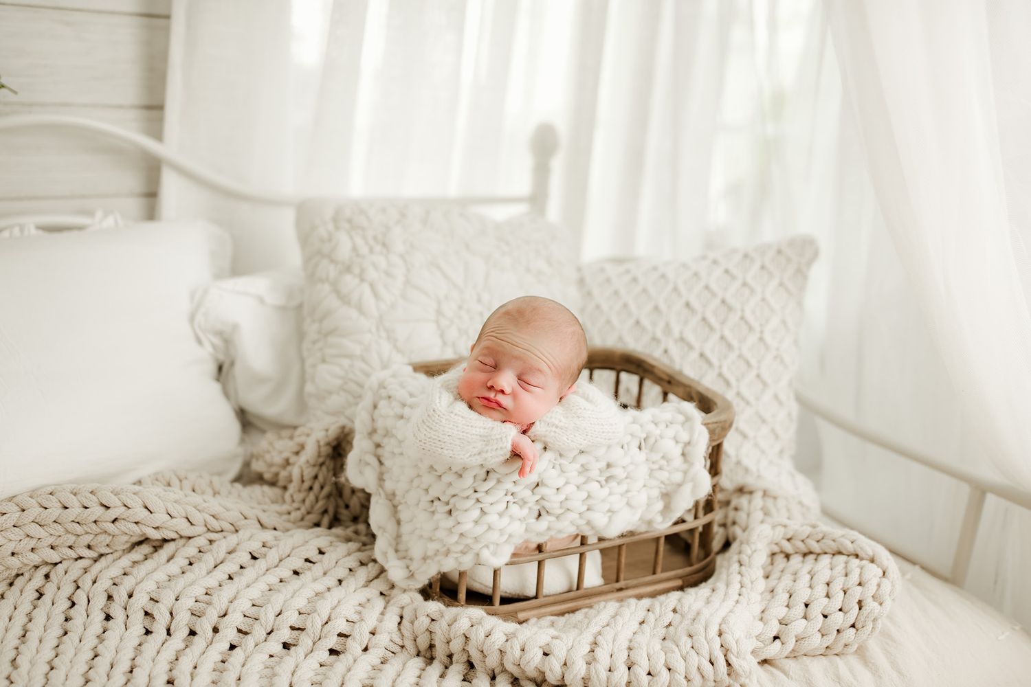 Newborn baby in white studio posed in basket | Professional Pittsburgh luxury newborn photographer